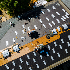South Creek Roofing & Waterproofing Inc. Roofing Services - Aerial view of buildling receiving roof replacement